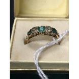 Jewellery: Gold emerald and diamond ring. Tests 9ct. 2.7gms.