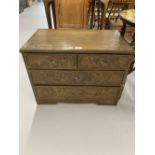 20th cent. Japanese cedar wood 2/2 low chest of drawers, carved with chrysanthemums. 24ins. x 18ins.