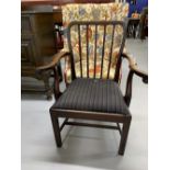 Late 18th cent. mahogany elbow chair, upholstered drop in seat, stick back square supports.