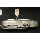 Corkscrews/Wine Collectables: Military penknife, chrome plated. Marked G M Clarke Rifle Brigade.