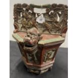 19th/20th cent. Chinese: Octagonal rice box, heavy carved relief's depicting horseman in combat,
