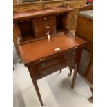 20th cent. Mahogany ladies desk. Pigeon holes and drawers above two drawer base and fold-out writing