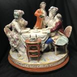 19th cent. Continental hard paste with a cross swords porcelain figurine of a group of people