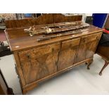 20th cent. Walnut veneered sideboard on club feet.