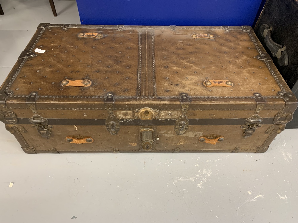 Late 19th/early 20th cent. Doherty & Roy, Montreal iron bound trunk. 41ins. x 12ins. x 21ins.