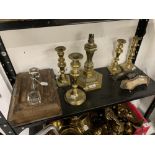 Metal Ware: 19th cent. Brass candlesticks, (5, one converted to a lamp). Approx. 8ins - 10ins. tall.