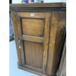 18th cent. Oak wall mounted corner cupboard with single door with shaped shelves. 30ins. x 40ins.