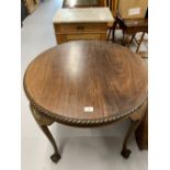 19th cent. Mahogany table on long cabriole supports rising off ball & claw feet. Diameter 29ins. x