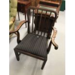 Late 18th cent. mahogany elbow chair, upholstered drop in seat, rail back square supports.
