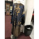 The Thomas E Skidmore Collection: Chinese blue silk, Dragon robe. The robe has eight 5 clawed
