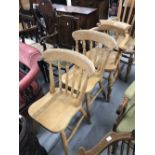 20th cent. Beech spindle back Windsor style chair plus 2 spindle back kitchen chairs.