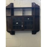 Early 20th cent. Oak wall hung display cabinet with 9 shelves and 2 leaded glass doors.
