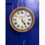 Clock: Circular oak wall clock, Mathers & Son Cambridge.