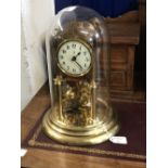 20th cent. Anniversary clock, under glass dome, enamel dial, Arabic numerals. Makers mark Bidische