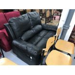 21st. cent. Leather two seater reclining black settee.