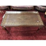 20th cent. Asian hardwood coffee table with brass inlay and glass top. 42ins. x 22ins. x 18ins.