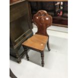 19th cent. Mahogany hall chair, solid back with scroll decoration and turned front supports.