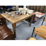 20th cent. Pine scrub top kitchen table on turned supports. 48ins. x 36ins. x 32ins.