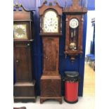 Clock: 19th cent. Flame mahogany longcase clock. Painted arch dial, floral spandrels, dome top