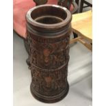 20th cent. West Indian, heavily carved mahogany stick umbrella stand. 24ins. high.