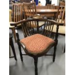 Edwardian mahogany corner chair with marquetry inlay on crossbar turned supports.