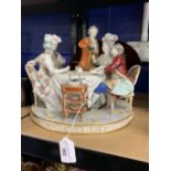 19th cent. Continental hard paste porcelain figural group of diners being served wine at table. (