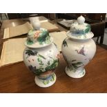 Oriental Ware: Baluster jars with covers, painted with exotic birds and flowers. A pair. 19ins.