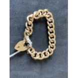 Jewellery: 9ct gold link bracelet with padlock fastener 1974. 80gms.