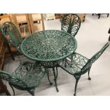 Modern painted metal garden dining table and four chairs.