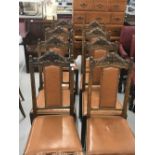 Early 20th cent. Oak, Gothic revival dining chairs, brown rexine back panels and seats x 8.