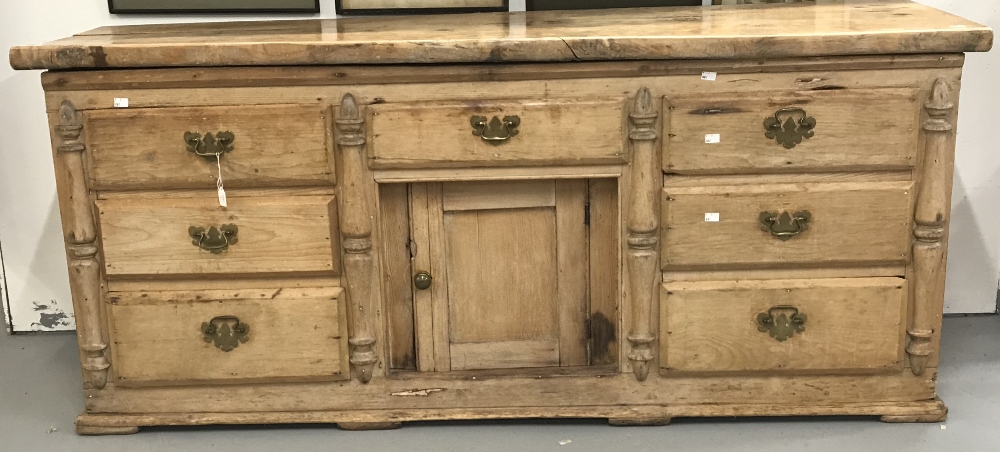 19th cent. Continental pine, seven drawer, one cupboard, dresser base with later top.