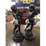 20th cent. Decorative patinated brass and gilt statues, musical putti on black marbled base. A