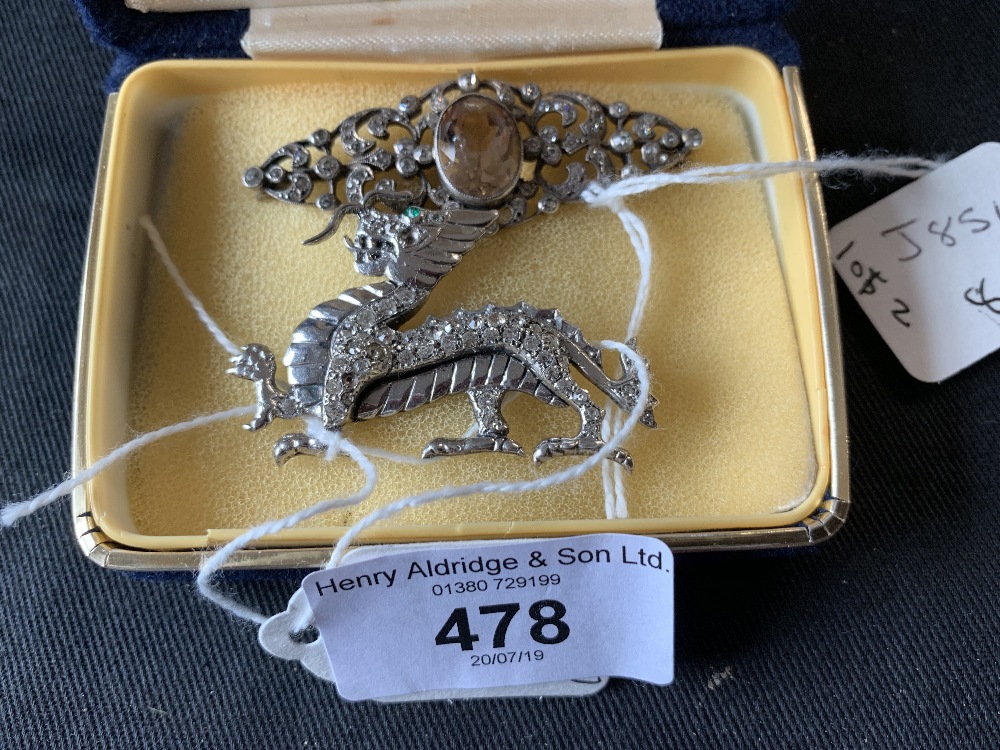 Costume Jewellery: Silver marked and tested C.Z. white stone dragon brooch. 15.6gms. Plus silver C.