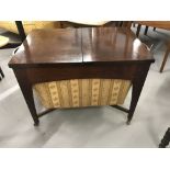 20th cent. Mahogany sewing box on castors, with split hinged lid opening to reveal an internal