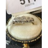 Jewellery: Ladies ring marked Plat. with diamond chip setting.