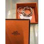 Hermes: Yellow metal Regate scarf ring with box.