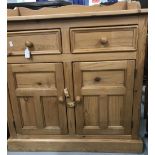 20th cent. Pine cupboard, 2 drawers over twin doors, solid gallery back. 35½ins. x 33ins. x 17½ins.