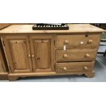 20th cent. Pine sideboard, 3 drawers adjoining twin door cupboard. 40ins. x 29ins. x 15½ins.