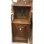 Edwardian mahogany coal scuttle with embroidered panel and carved Art Nouveau decoration.