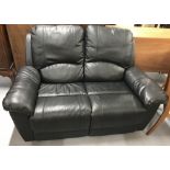 21st. cent. Leather two seater reclining black settee.