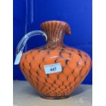 20th cent. Czech art glass pitcher. Orange with peacock feather stylised design. 9ins. Unsigned.