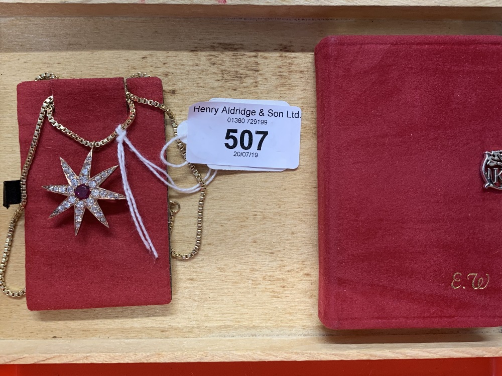 Jewellery: 19th cent. Eight pointed star brooch with centrally set ruby surrounded by pave set