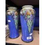 Doulton: Art Nouveau Lambeth vases, blue ground with hanging groups of apples, grapes and leaves.