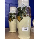 Royal Doulton: Lambeth grape vine baluster vases, decorated by Ethel Beard No 8527. Impressed