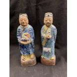 19th cent. Chinese terracotta figures. A couple robed in purple and blue splashed glaze, upon