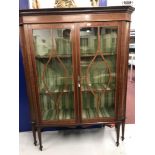 19th cent. Mahogany display cabinet, moulded glazed doors, ebony and boxwood inlay. Concave canted