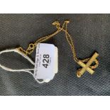 Jewellery: Yellow metal cross and chain marked 9ct. 2 grams.