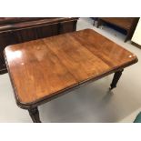 19th cent. Mahogany wind out table with one leaf. On turned and gadrooned supports, rising off