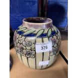 Royal Doulton: Lambeth art deco stone ware vase with floral motifs, crafted by Florrie Jones. This