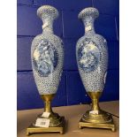 Ceramics: Two 20th cent. Continental vases with brass base stands and rims, decorated with panels